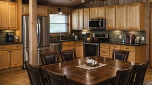 A kitchen with wooden cabinets, stainless steel appliances, and a dining table with chairs.