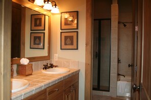 Combined shower/bathtub, hair dryer, towels, soap