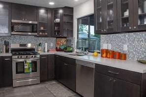 Enjoy cooking in this well-equipped kitchen with a stainless steel range, oven, and dishwasher.