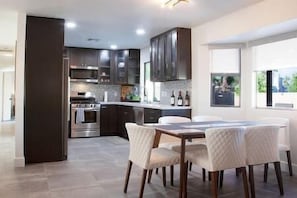 Enjoy meals in the adjacent dining area with an oven and microwave.