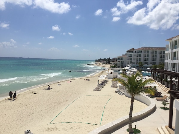 On the beach, sun-loungers, beach towels