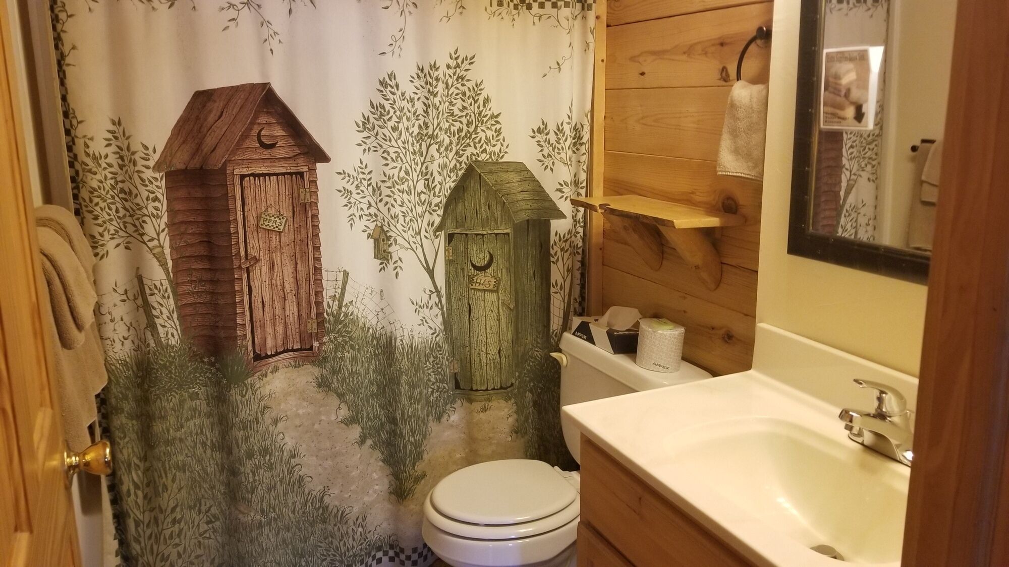 Tina con regadera, secadora de cabello, toallas 