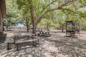 An outdoor area with picnic tables and a gazebo.