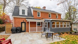A two-story house with a brick exterior and a grey siding extension. - Remodeled, Updated, Perfect Location Next to Downtown/PSU! (State College)