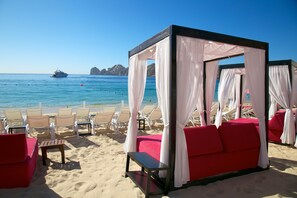 On the beach, sun loungers, beach towels