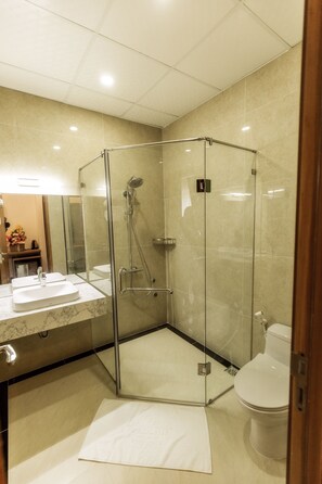 Shower, free toiletries, hair dryer, slippers