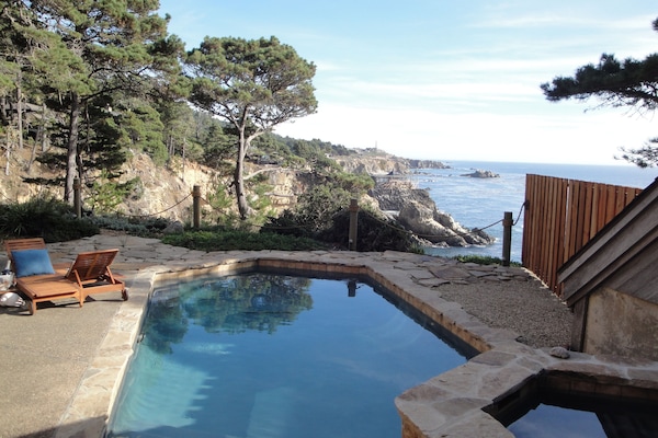 Bluff top swimming pool and spa. 80 feet above the cove.