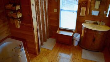 Bathtub, jetted tub, towels, soap
