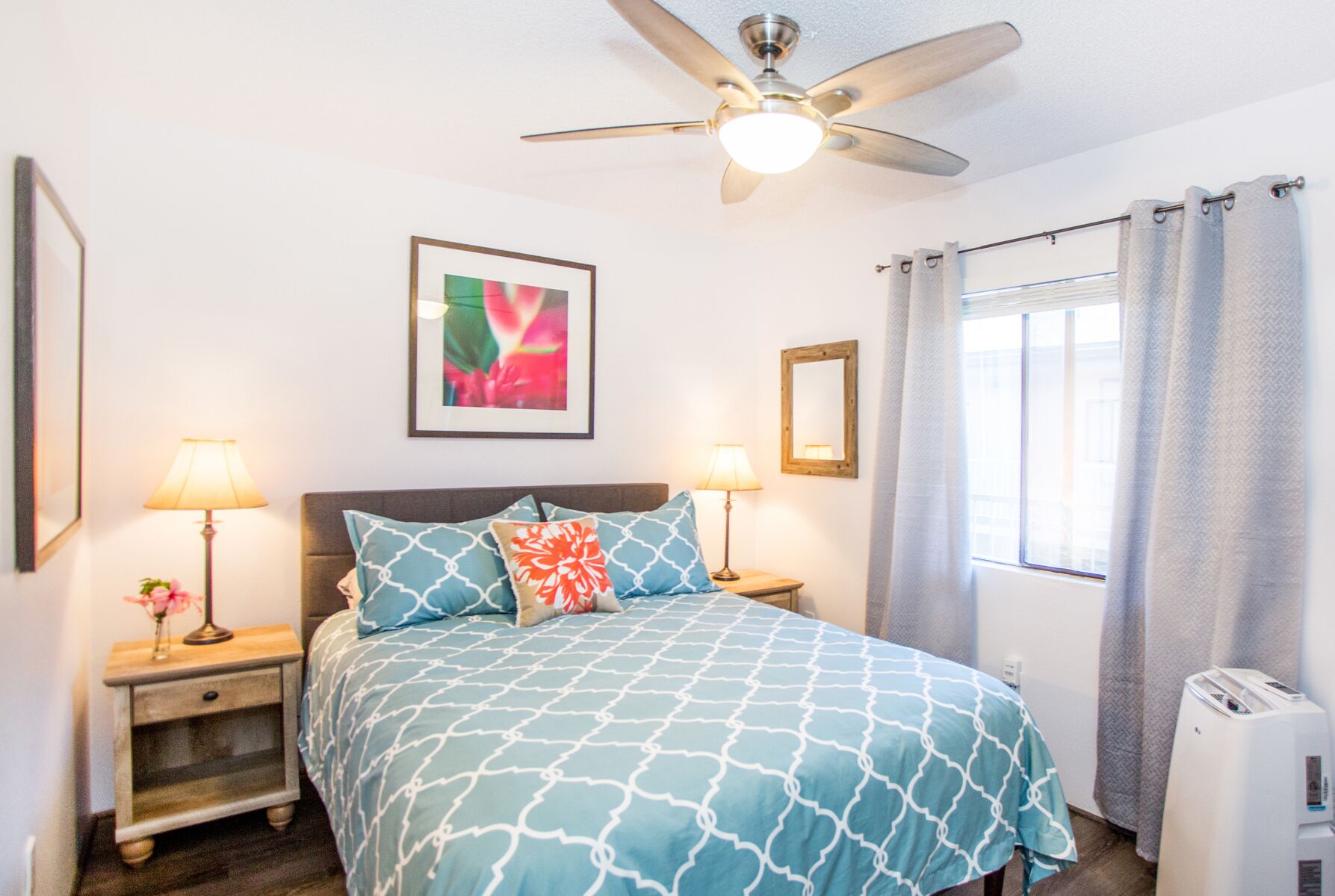 The North bedroom offers queen bed and AC