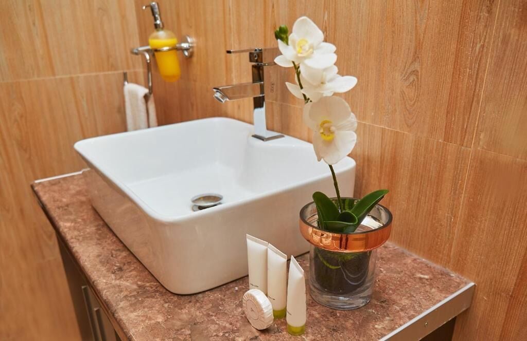 executive suite | bathroom | deep-soaking bathtub, rainfall showerhead, designer toiletries