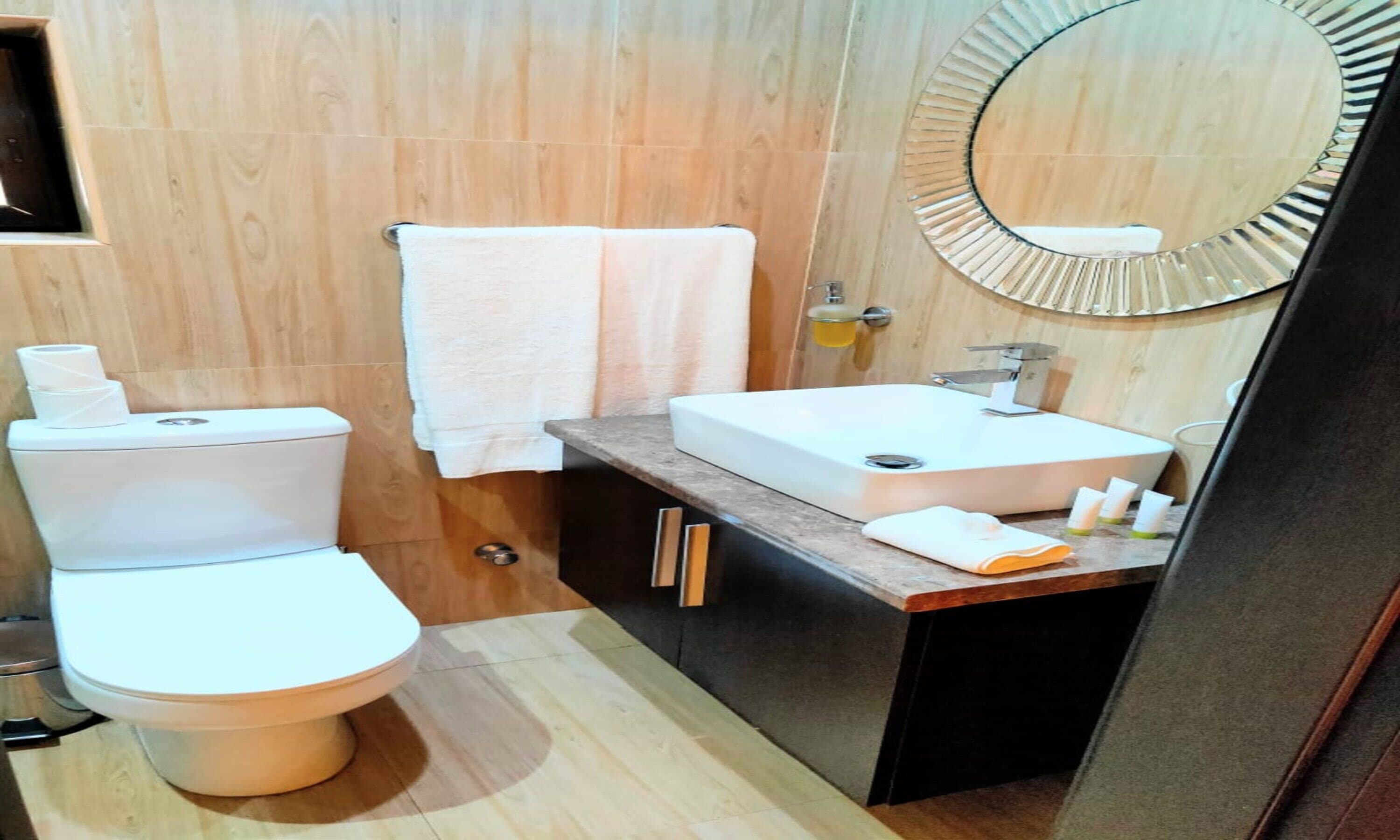deluxe room | bathroom | deep-soaking bathtub, rainfall showerhead, designer toiletries