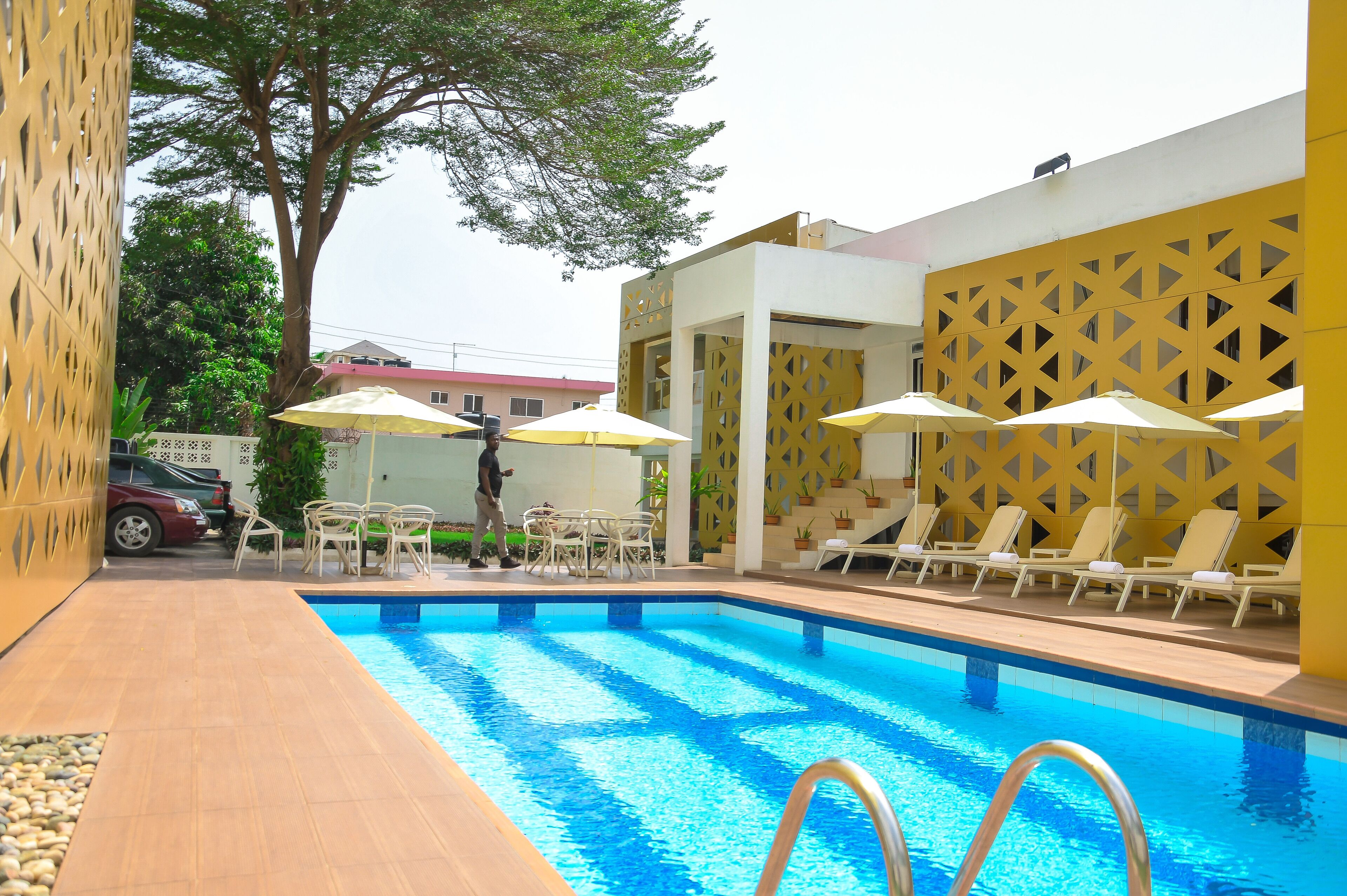 indoor pool, pool umbrellas, pool loungers