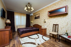 Premium bedding, down duvets, blackout curtains, iron/ironing board