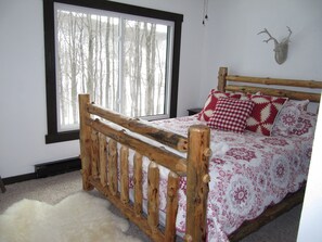 The 'Lake' master bedroom - with beautiful views of the lake & the slopes