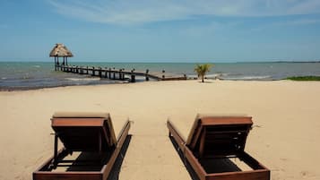 On the beach, sun-loungers, beach towels