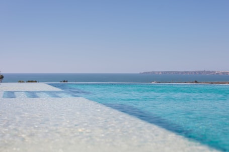 Indoor pool, outdoor pool, pool loungers. Longevity Health and Wellness Hotel - Adults Only