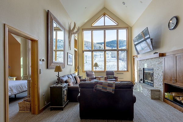 Great room with queen sleeper sofa. Overlooks slope.