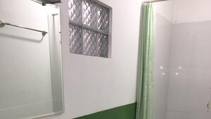 Shower, rainfall showerhead, slippers, towels