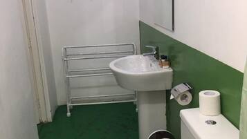 Shower, rainfall showerhead, slippers, towels