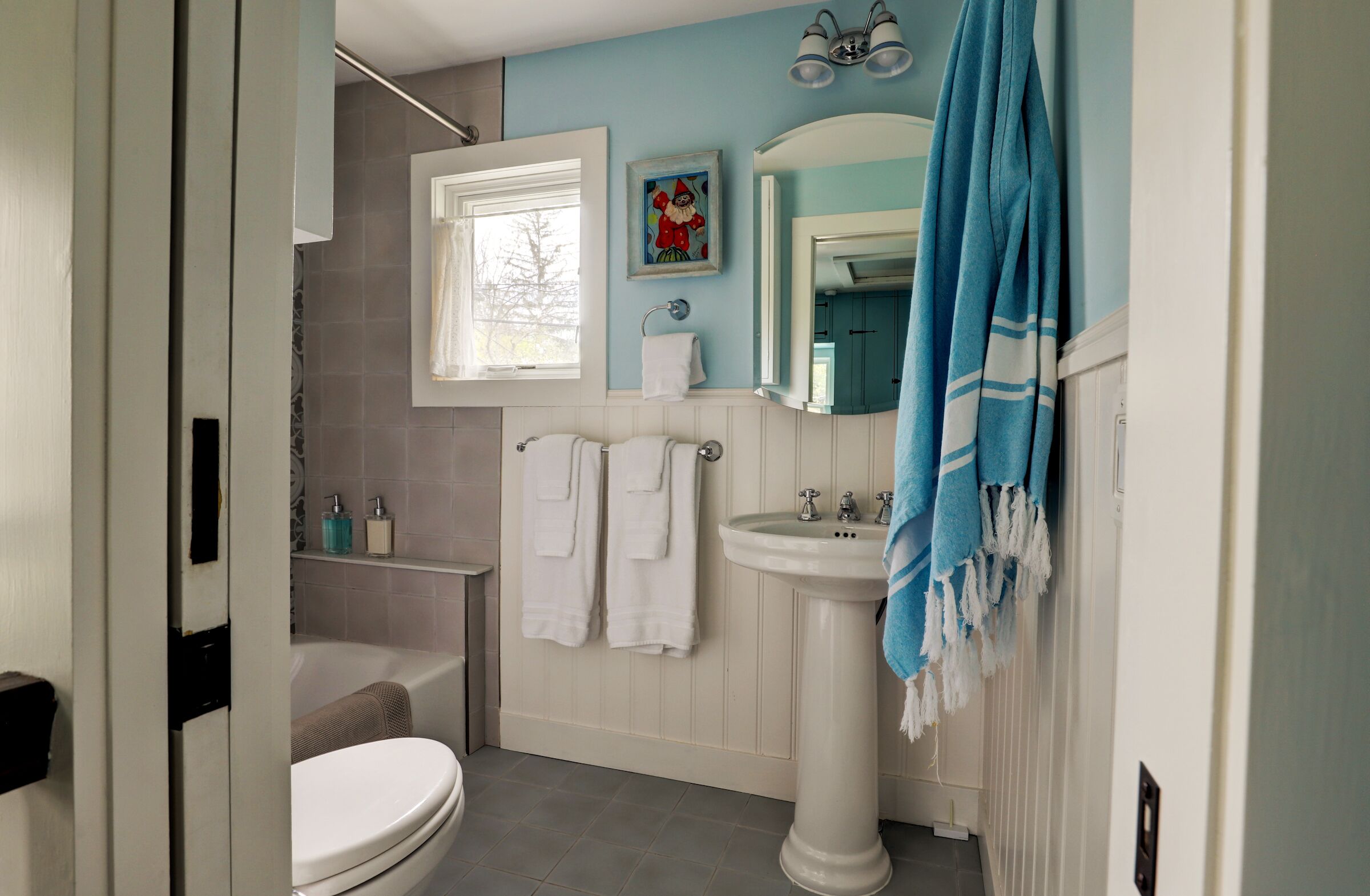 Second Floor Bathroom with Tub Shower and Turkish Towel and Pocket Doors