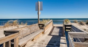 Walk along the boardwalk to the ocean and enjoy the view of the sandy dunes.