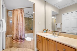 Bathtub, hair dryer, towels, soap
