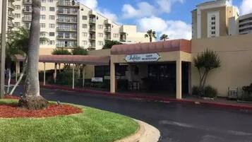 A hotel with a sign reading "Hotel El Cortez".