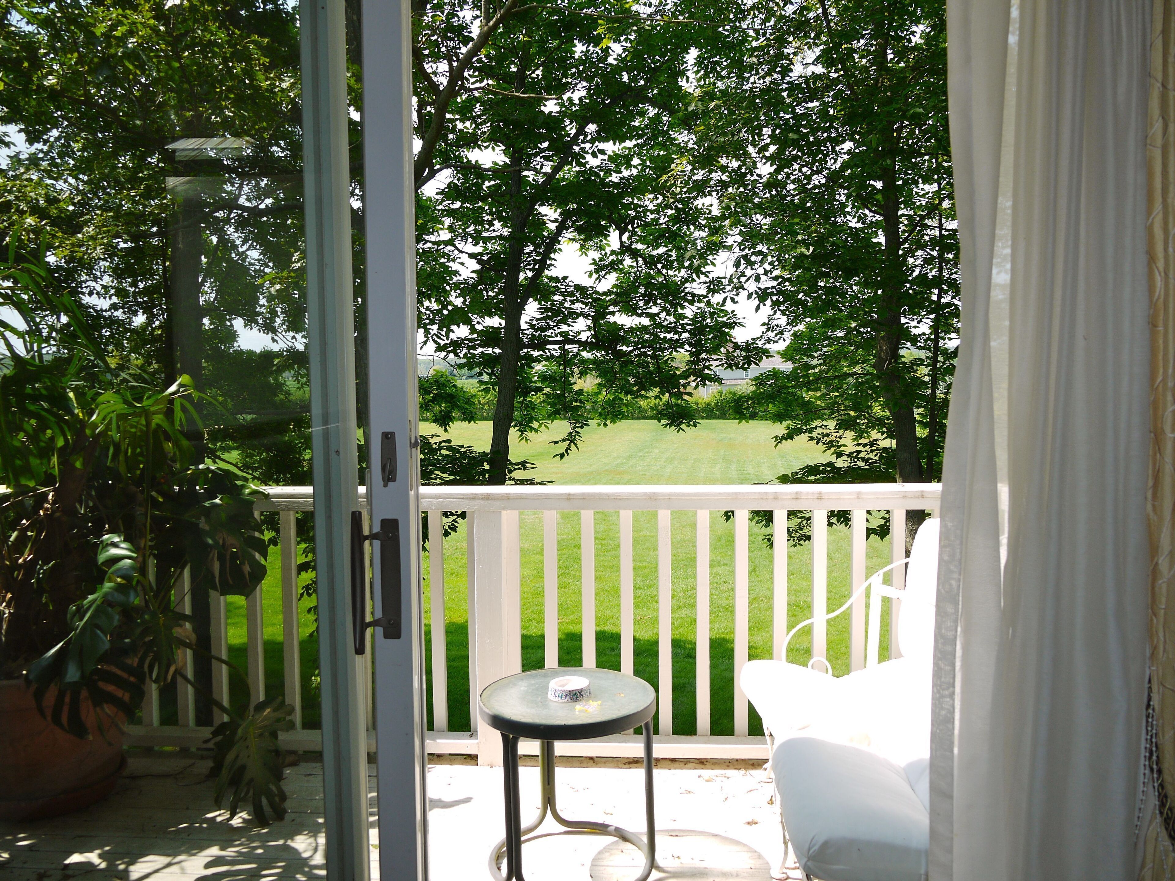 upstairs balcony off loft area living room looking out onto field
