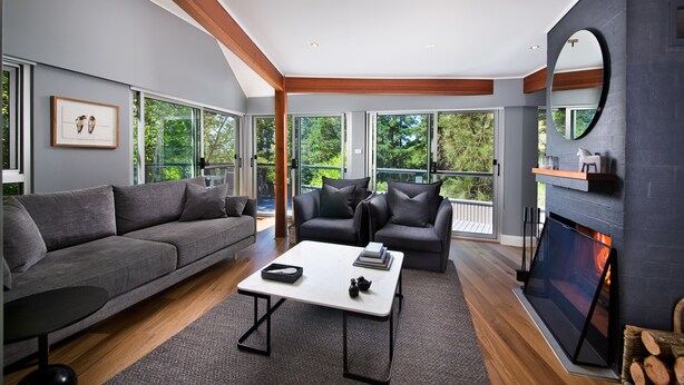 A modern living room with a grey sofa, a white coffee table, and a fireplace. - Maple View Medlow Bath, Blue Mountains (Medlow Bath)
