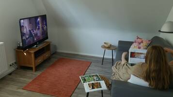 Apartment, 1 Bedroom | Living area | Smart TV