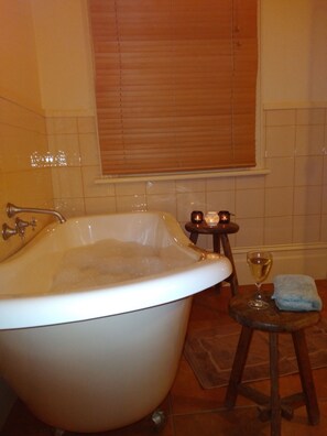 Bathtub, hair dryer, towels, soap