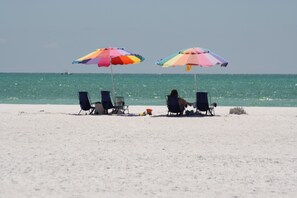 On the beach, sun-loungers, beach towels