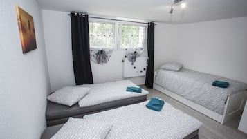 Triple Room, Shared Bathroom | Individually decorated, individually furnished, blackout curtains