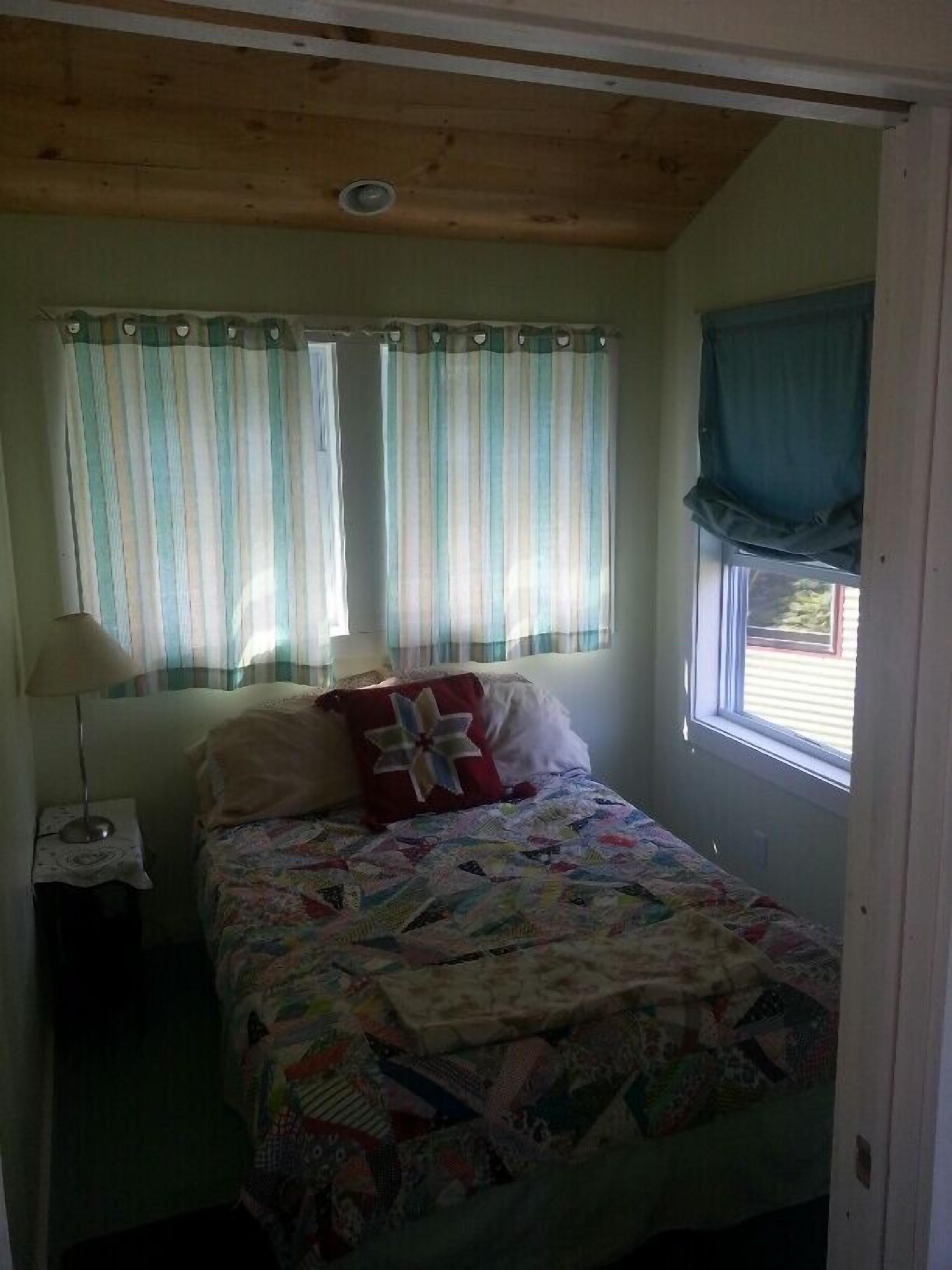Cottage with Bunkhouse.  Spacious yard with privacy.  Close to Head Beach