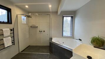 Bathtub, hair dryer, towels, soap
