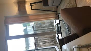 Apartment, 2 Double Beds, Non Smoking | Living room | Flat-screen TV