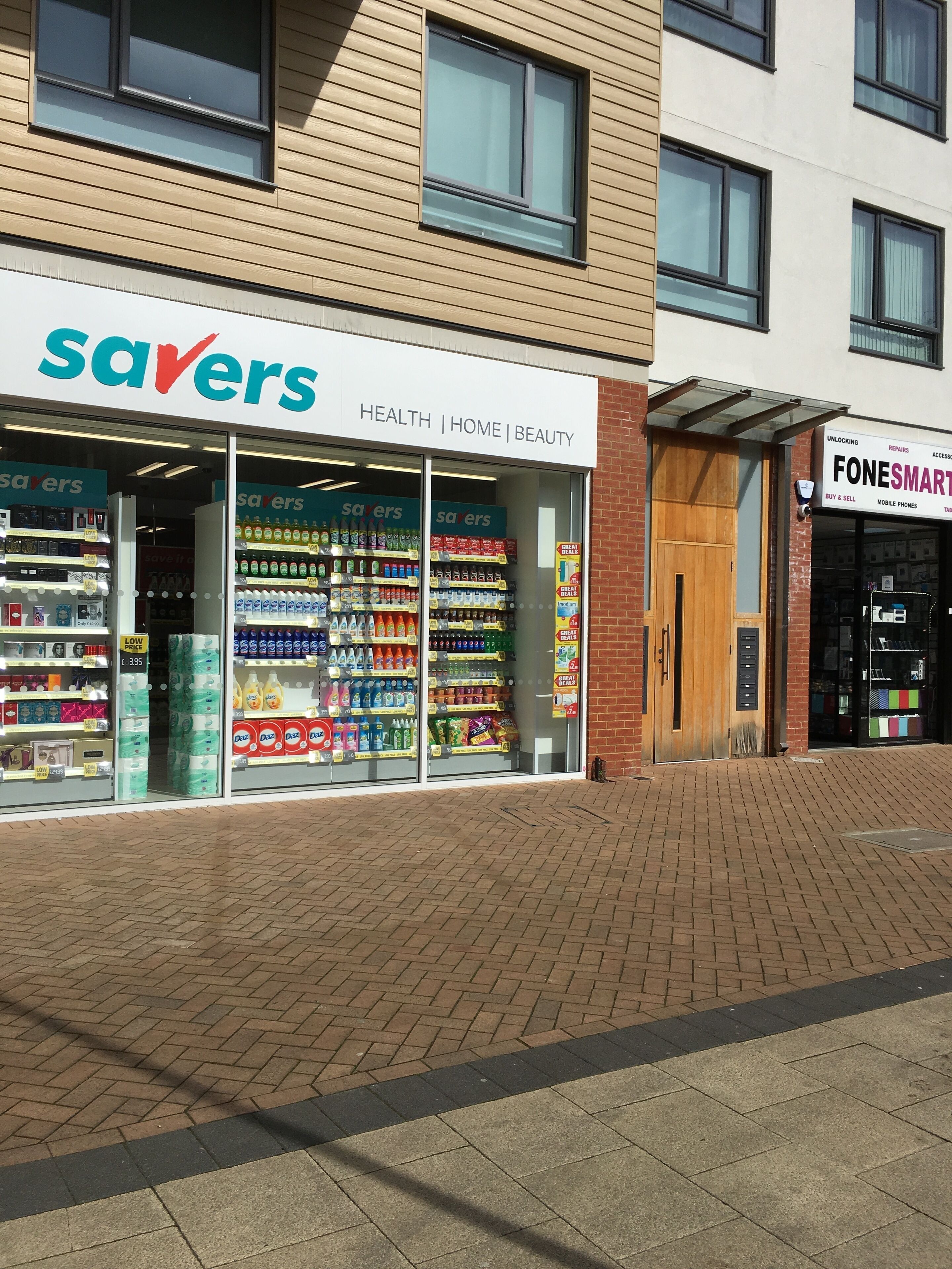 A storefront with 'savers' branding, featuring health, home, and beauty sections.