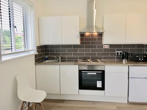 Apartment, Balcony | Private kitchen | Fridge, microwave, oven, stovetop