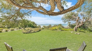 Relax amidst lush greenery and serene water views.