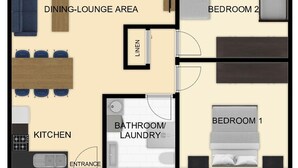 A hotel layout with a balcony, dining lounge area, two bedrooms, a kitchen, and a bathroom/laundry area.
