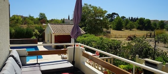 Sunny A/C apartment with terrace overlooking countryside and private pool