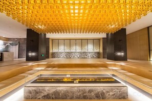 A spacious lobby with a marble reception desk, a large seating area, and a decorative ceiling. - Zhuozheng International Hotel (Baoding)