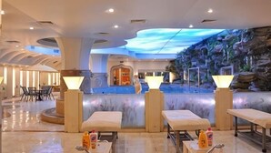 A hotel lobby with a central fountain, seating areas, and a digital sky projection on the ceiling. - Zhuozheng International Hotel (Baoding)