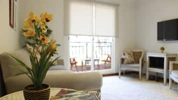 City Apartment, 2 Bedrooms, Balcony, City View (ORQUIDEA) | Living area | Flat-screen TV