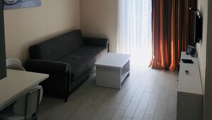 Apartment | Living room | 60-cm LCD TV with digital channels, TV, Netflix - Orbe Sea Tower ONE (Batumi)