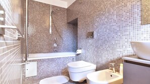 Combined shower/tub, hair dryer, towels, soap