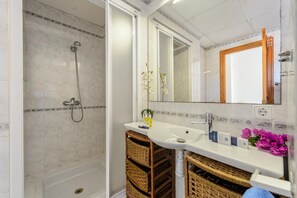 Bathtub, hair dryer, towels, soap
