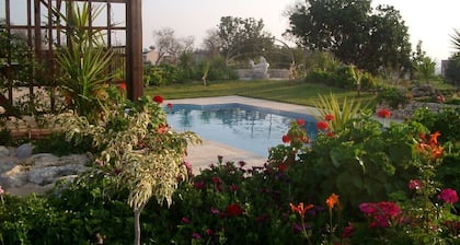 A charming villa set in beautiful gardens with sea & mountain views