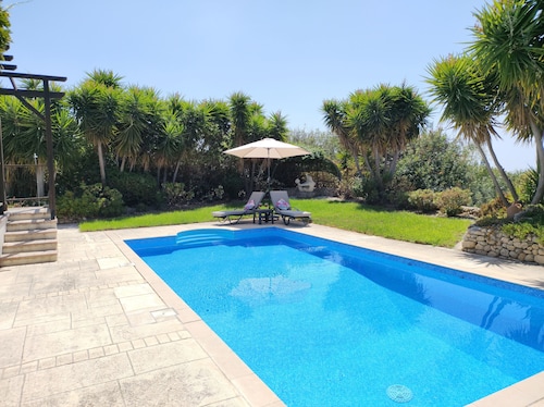 A charming villa set in beautiful gardens with sea & mountain views 