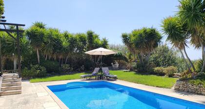 A charming villa set in beautiful gardens with sea & mountain views